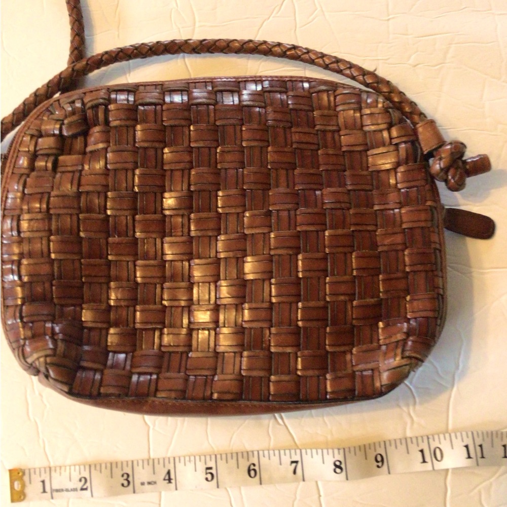 Dillard’s vintage leather woven shoulder handbag, brown.